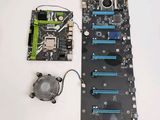 a motherboard with a fan and a cooling pad on it