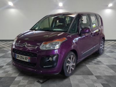 a picture of a purple citrole parked in a showroom