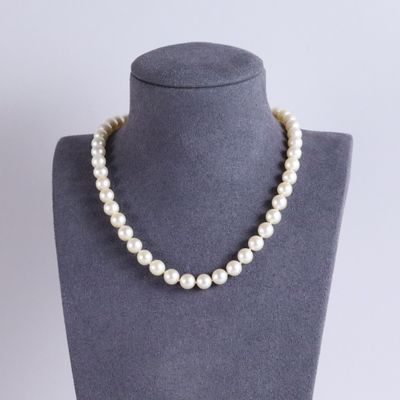 a close up of a necklace on a mannequin mannequin
