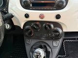a car dashboard with a steering wheel and dashboard controls