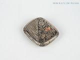 an image of a silver and gold locke with a bird on it