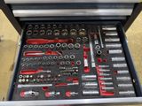 a tool box full of tools sitting on the floor