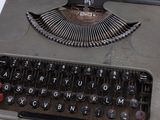 an old typewriter sitting on top of a table