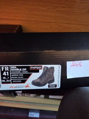 a box with a pair of boots on top of it
