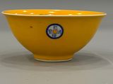 yellow bowl with a blue and white design on the side