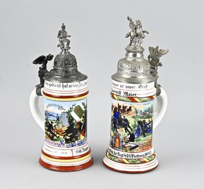 two beer mugs that are sitting next to each other