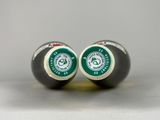 pair of black and white pool balls with green logo on them