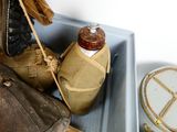 a brown bag and a brown purse in a blue box