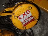 a close up of a yellow and black fire hydrant on the ground