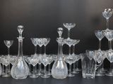 a lot of wine glasses that are sitting on a table