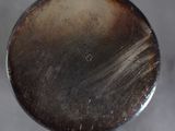 a close up of a metal object on a table