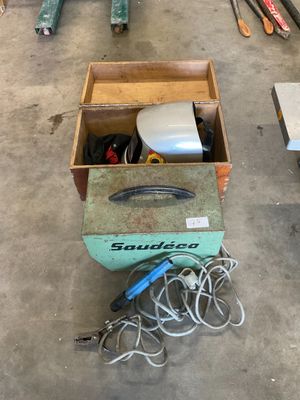 a box of tools sitting on the floor in the garage