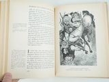 a person holding a book open to a picture of a man on a horse