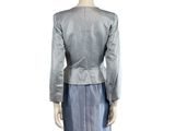 the back view of a mannequin wearing a blue skirt and jacket