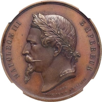 une vieille médaille en bronze représentant un homme barbu couronné de laurier
