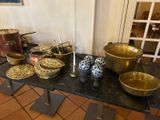 a table with a bunch of bowls and pans on it