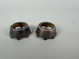 two rings sitting on top of each other on a table