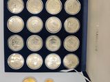an image of a box full of coins with a few coins in it