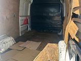 a van that has a lot of wood in the back