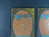 two decks of magic the gathering are on display on a table