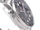 a close up of a watch on a metal bracelet