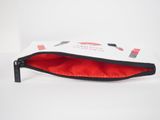 a white and red zippered pouch with a black zipper
