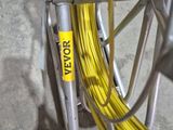a close up of a yellow wire on a bike rack