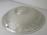 a silver plate with a lid on a white counter