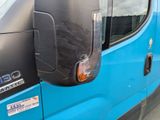 a close up of a blue van with a black door