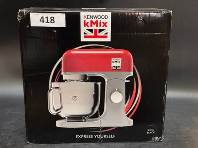 packaging of a kenwood mixer in a box on a table