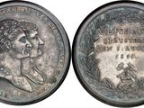 a close up of a coin with a woman ' s face on it