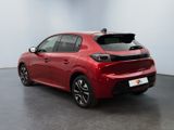 a red toyota corollant parked in a room with a white wall