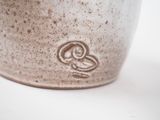 a close up picture of a cup with a design on it