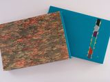 two books that are sitting on a white table