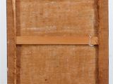 an old picture frame with a piece of wood on top of it