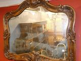 a mirror hanging on the wall in a room