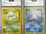three pokemon cards are displayed in a plastic case on a table