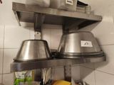 two pots and pans on the shelf in the kitchen