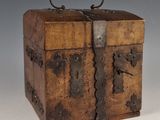 a small wooden box with a handle on top of it