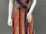 a mannequin wearing a multicolored dress on a mannequin