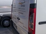 a white van that is parked in a lot