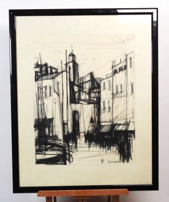 dessin représentant un paysage urbain, dans un cadre noir et blanc, posé sur un chevalet en bois