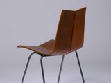 the chair is made of wood and metal with a black frame