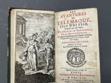 an old book with a picture of a man and a woman on it