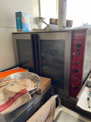 a microwave sitting on top of a counter next to a microwave oven