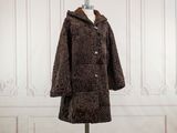 an image of a coat on a mannequin stand
