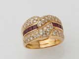 an 18k gold ring set with rubies and diamonds