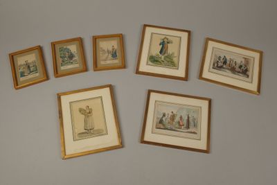 several framed pictures of people and animals on a wall