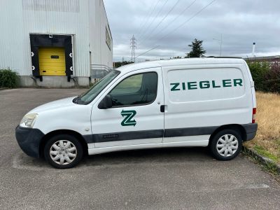 a white van that is parked in a parking lot