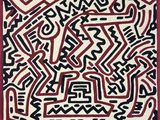 un tapis rouge et blanc orné de motifs noirs et blancs